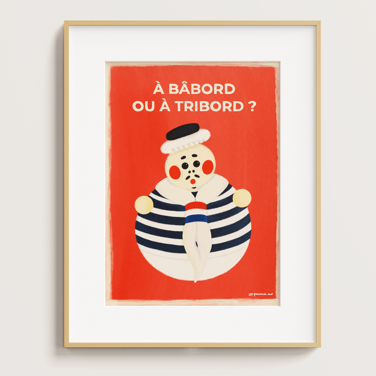 Affiche Matelot Culbuto Pommie avec marin breton et citation « À bâbord ou à tribord ? », encadrée avec cadre en bois clair